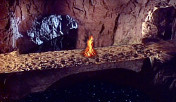 the Mirror Pool Below, with a fire burning next to it